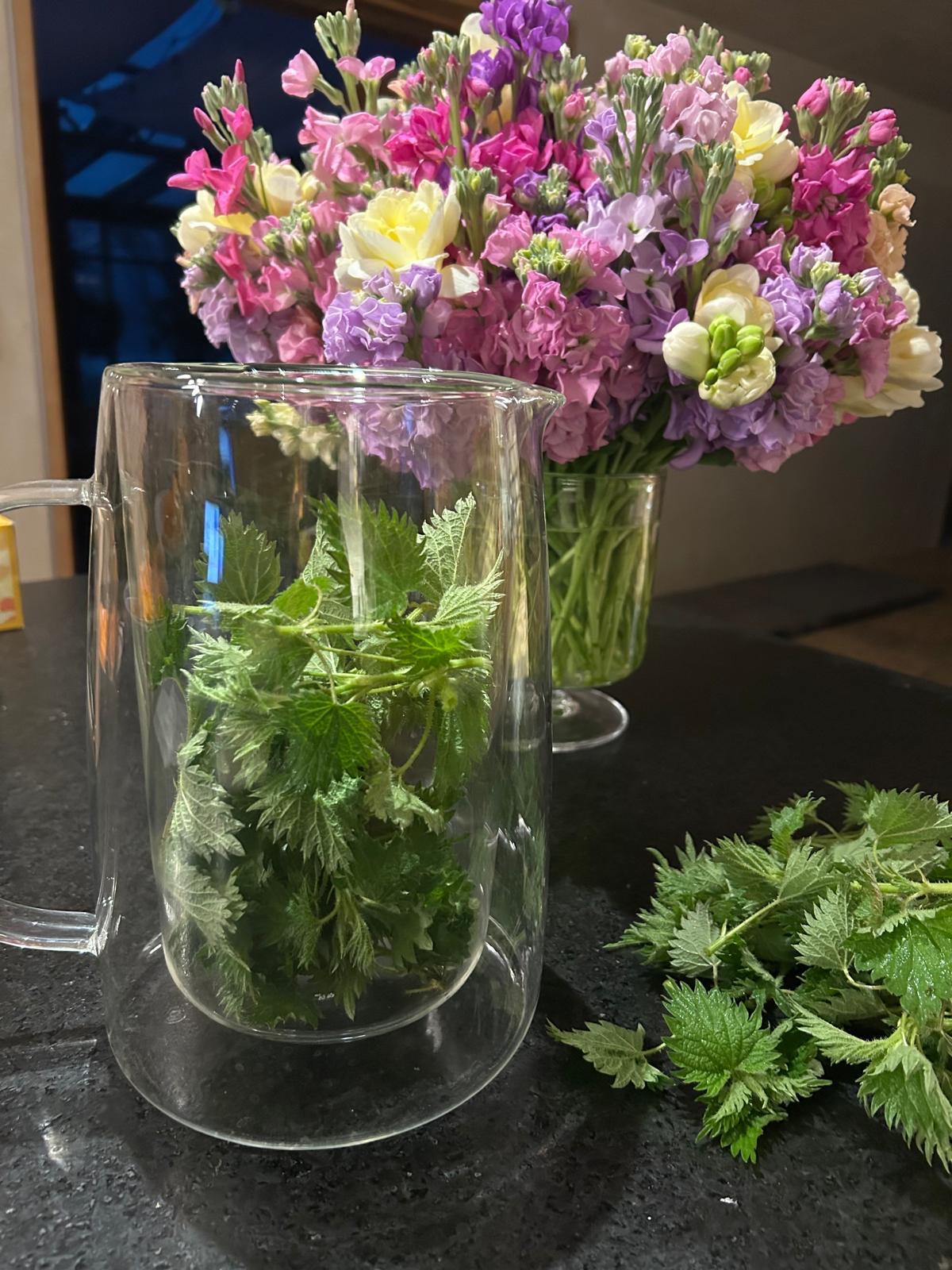 Fresh flowers and herbs prepared as part of a daily ritual
