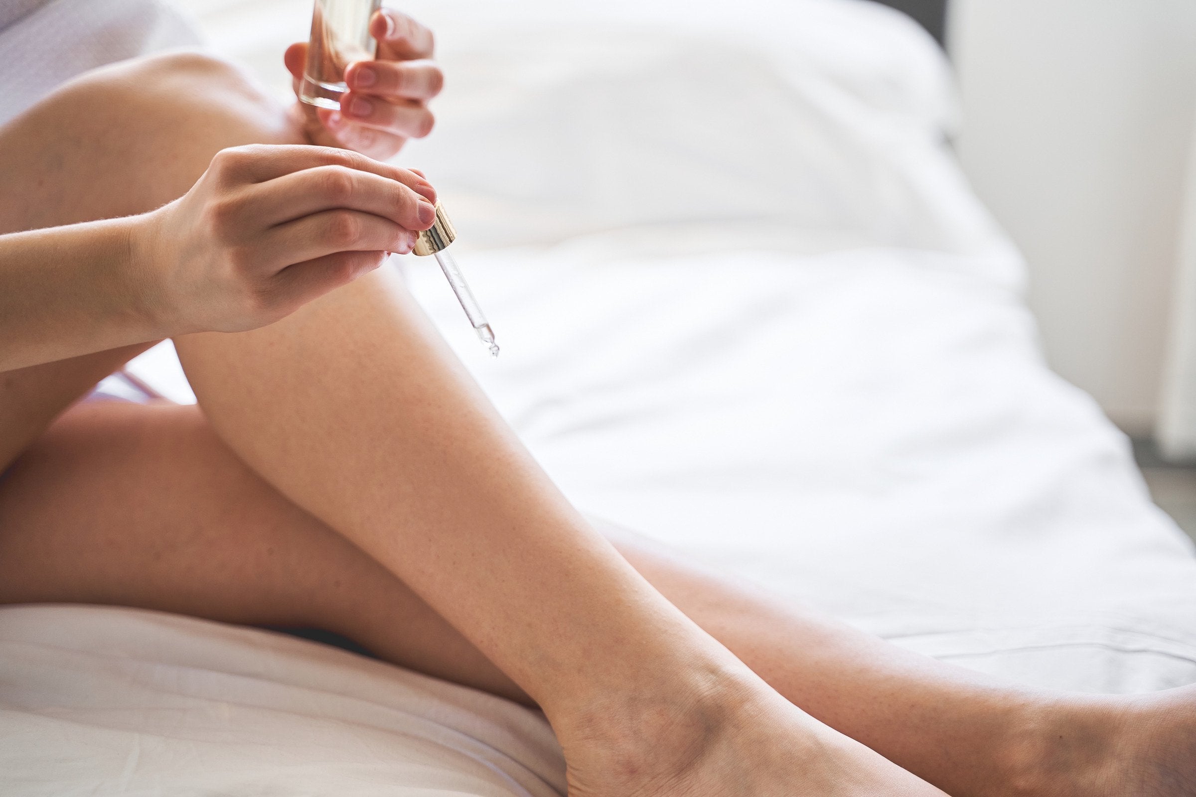 Oil being applied to legs