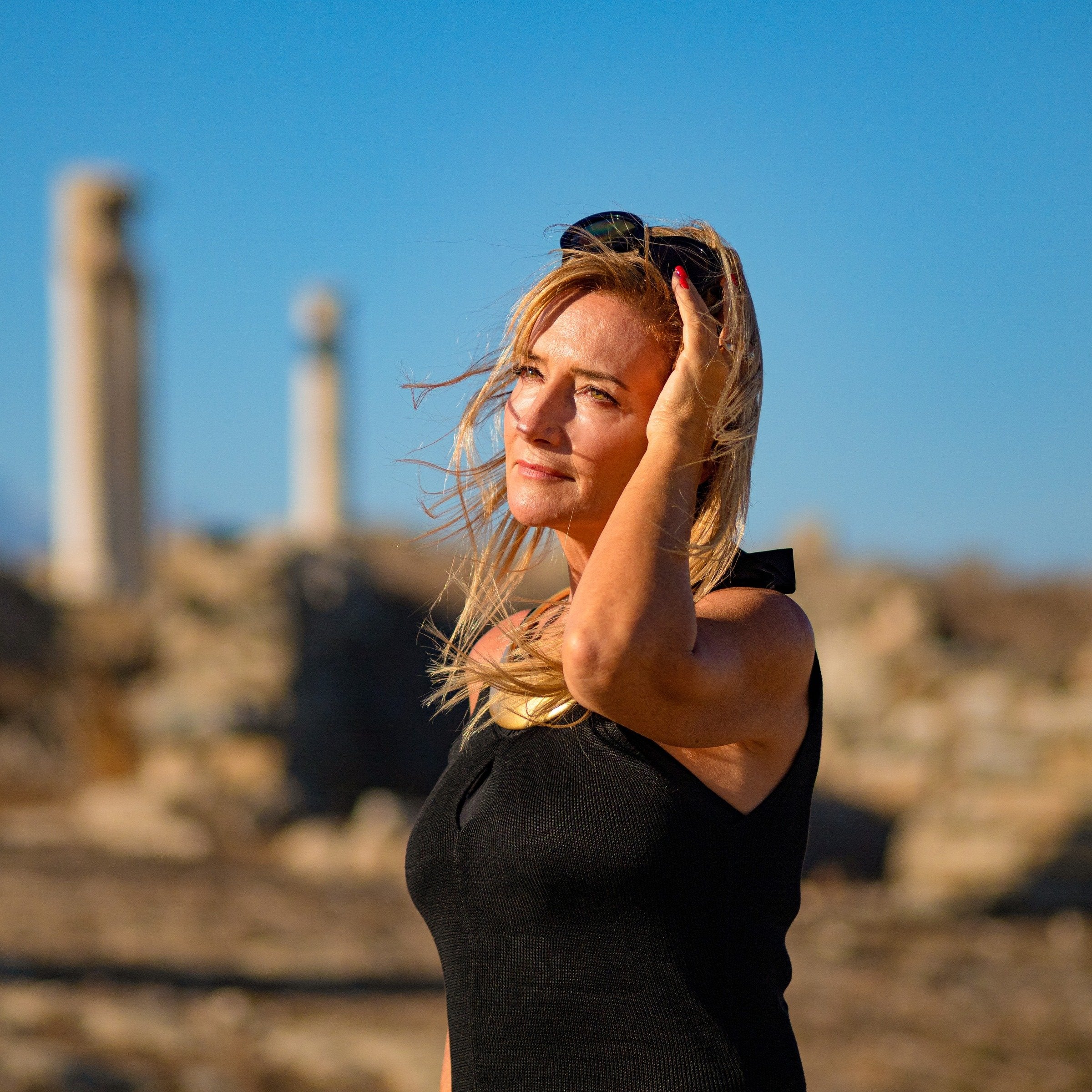Woman in warm sunlight representing the Eternal Glow ritual